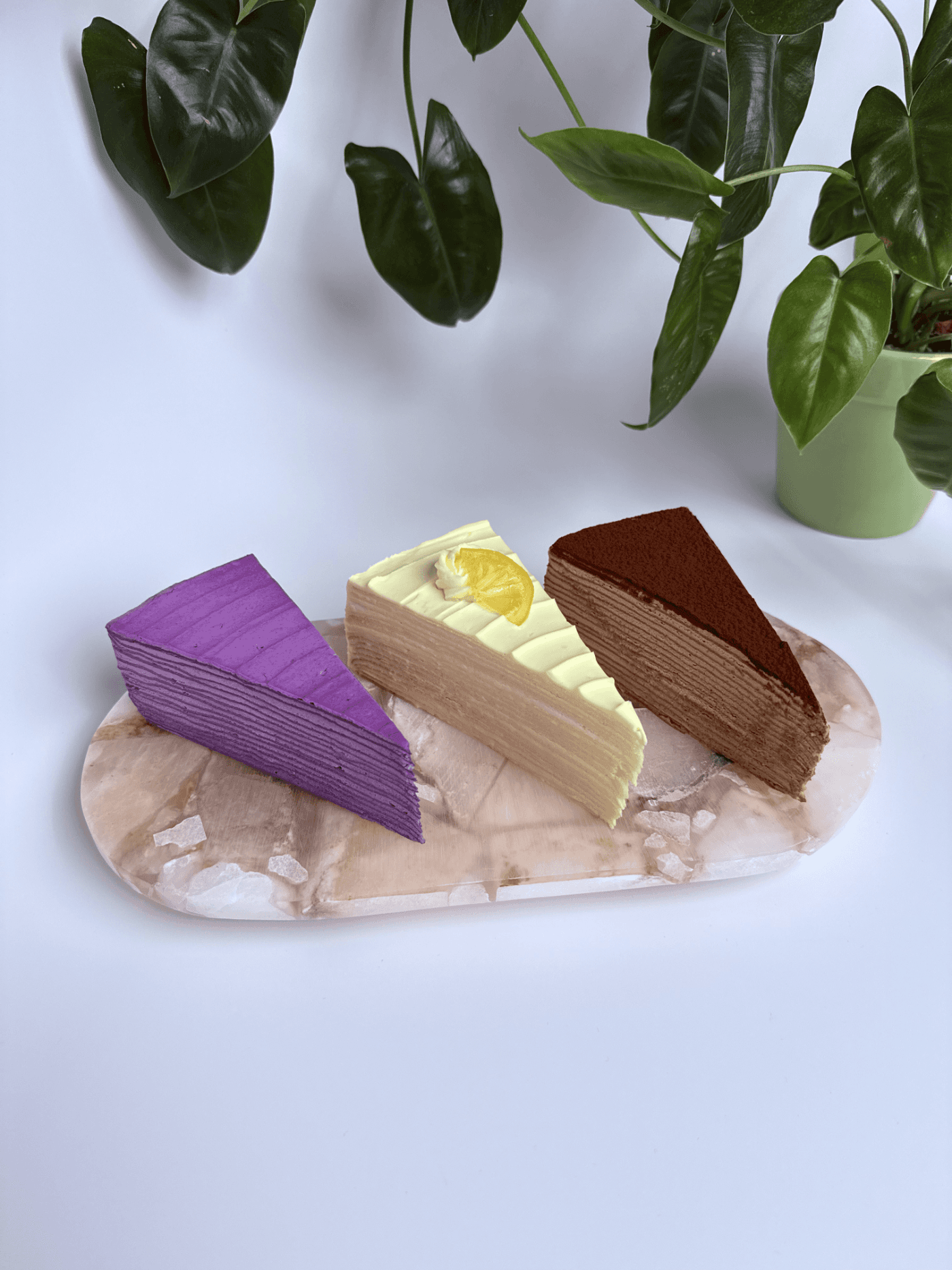 A trio of mille crêpe slices